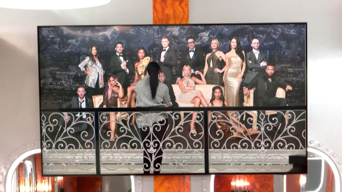 Big Brother Canada 12-Avery looks at picture